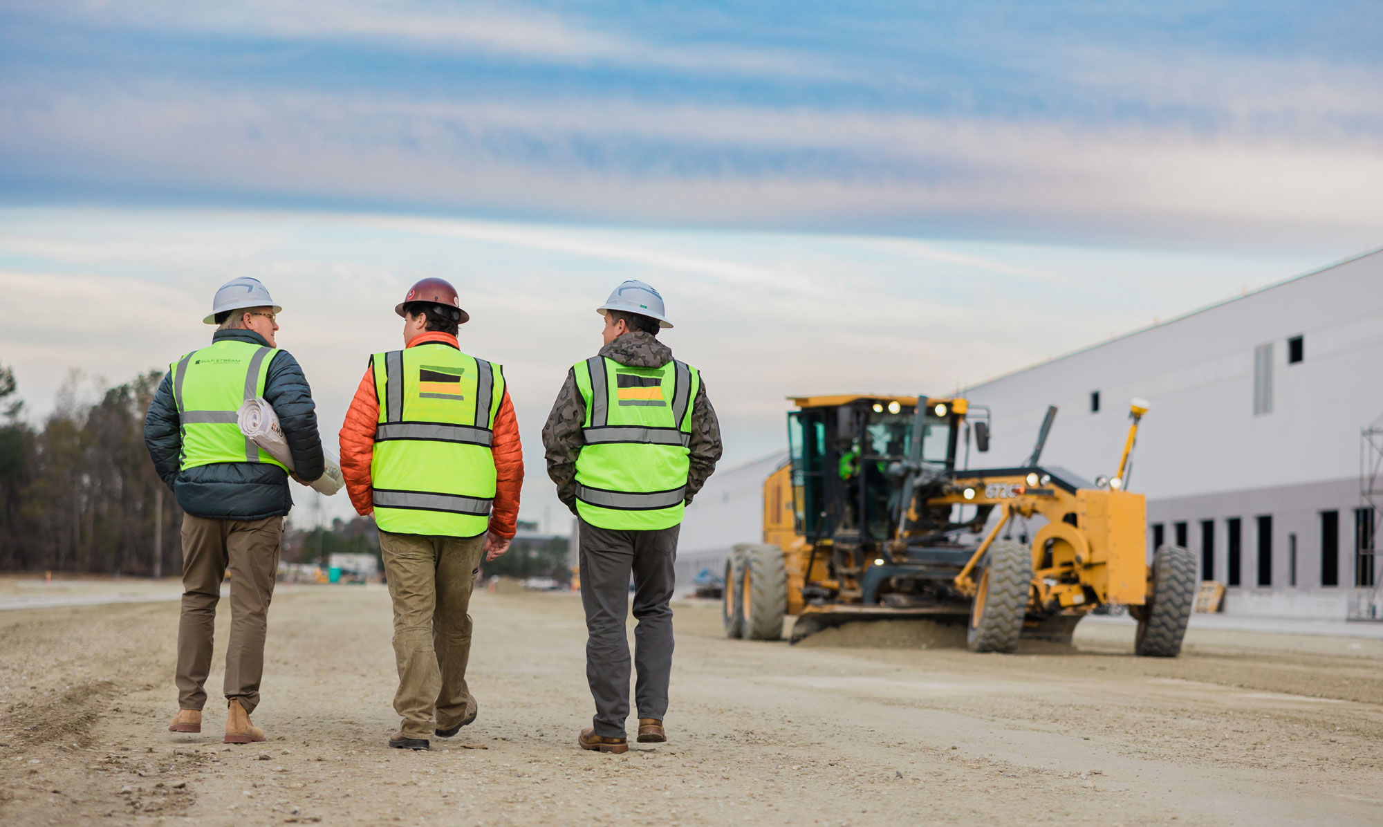 Gulf Stream Construction team members conversing on project site